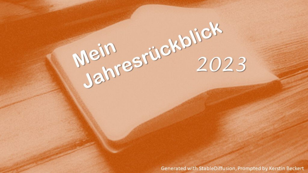 Bild eines aufgeschlagenen Tagesterminers. Dieses wurde in orange eingefärbt und trägt eine weisse Aufschrift. Text: "Mein Jahresrückblick 2023"
